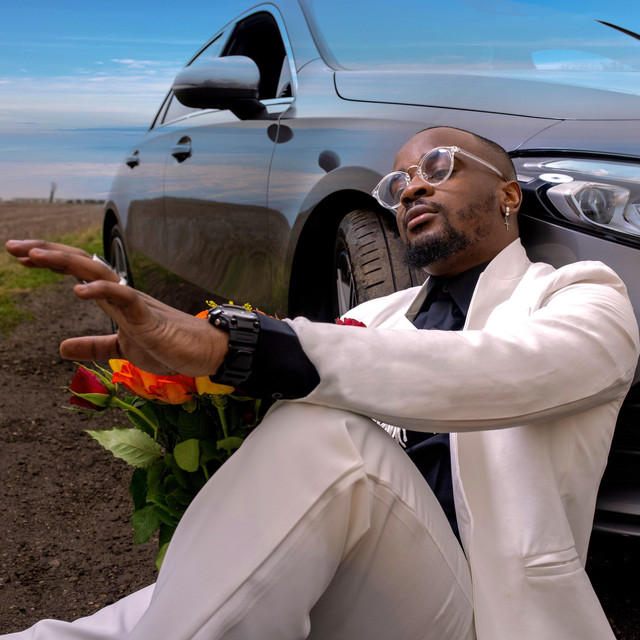 Garry Mapanzure leaning on a car